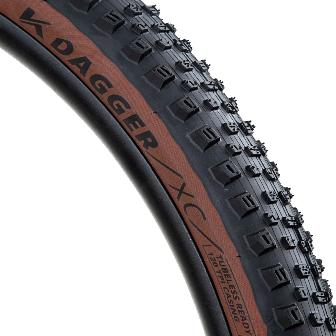 Close-up of a Kenda Dagger XC bicycle tire on a white background