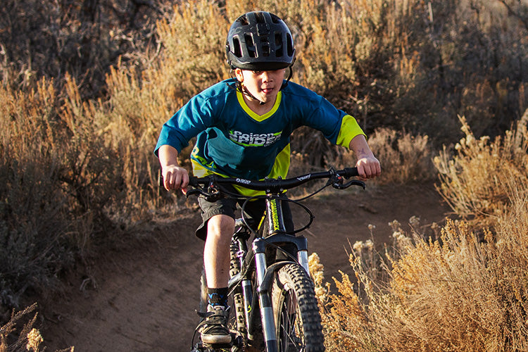 Child riding Kenda mountain bike tires